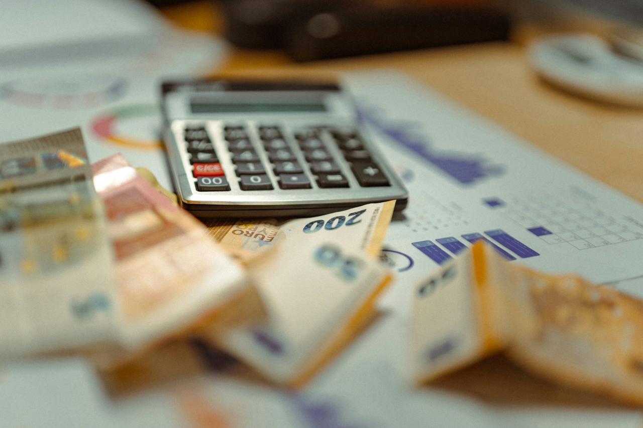 Person reviewing statements before making an extra debt payment
